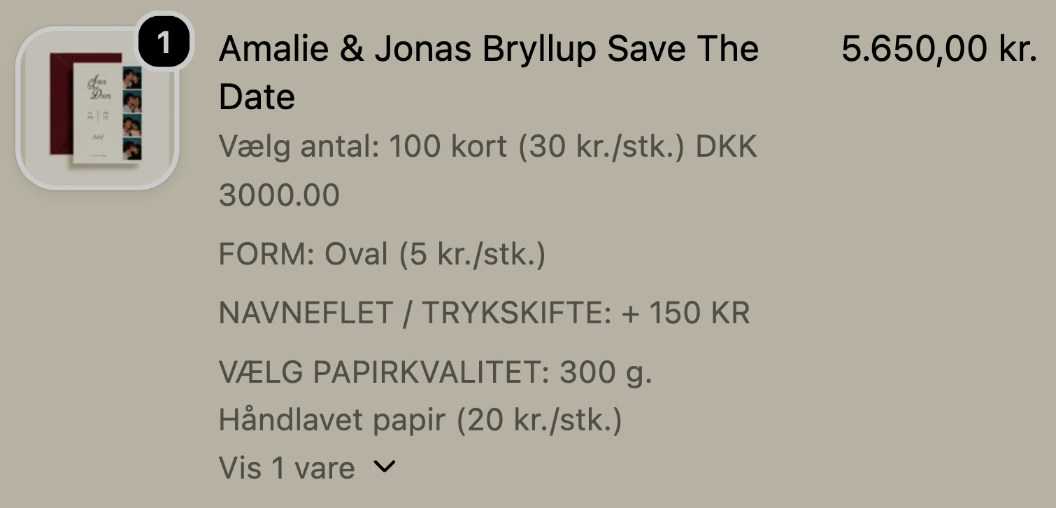Varen i kurven med de valgte tilvalg: 100 kort, Form: Oval, Navneflet / Trykskifte, Papirkvalitet: 300 g. Håndlavet papir