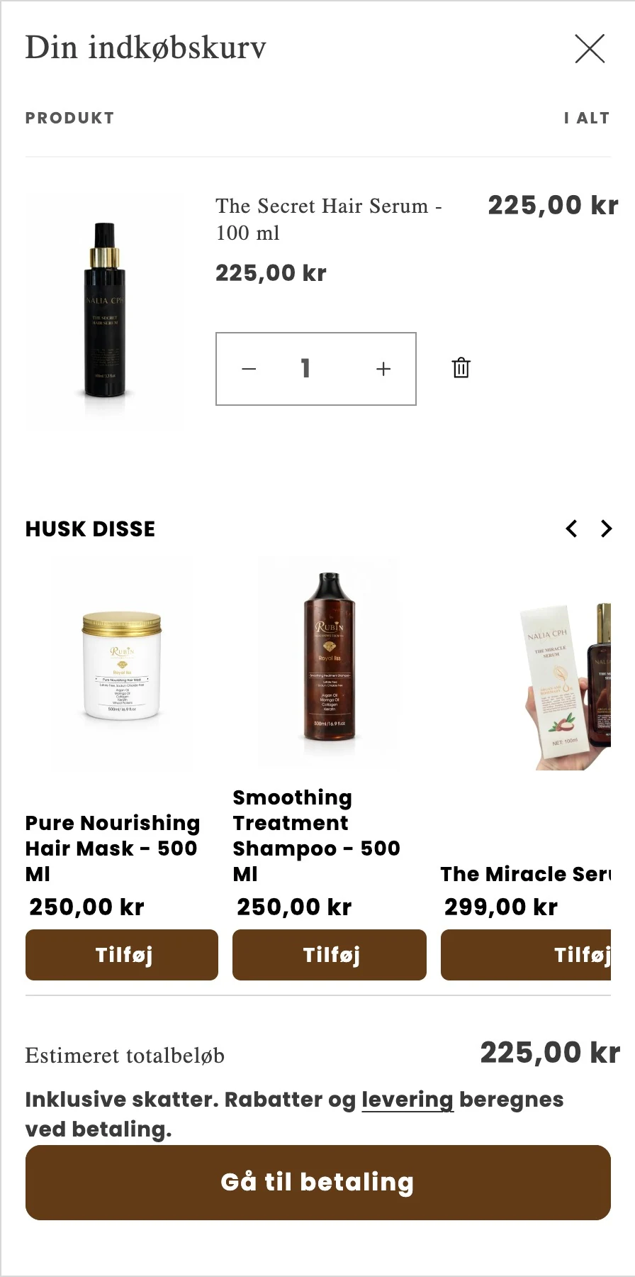 Kurven med The Secret Hair Serum og afsnittet Husk disse med tre supplerende produkter og knappen Gå til betaling